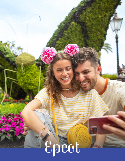 Couple taking a selfie at flower garden in Epcot