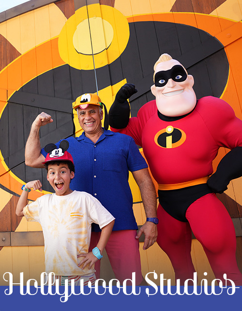 Father and son posing with Mr. Incredible at Hollywood Studios