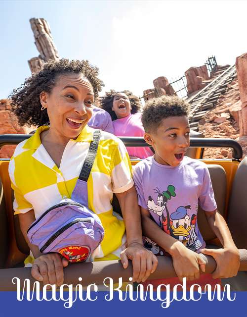 Mom and son riding a roller coaster at Disney Magic Kingdom