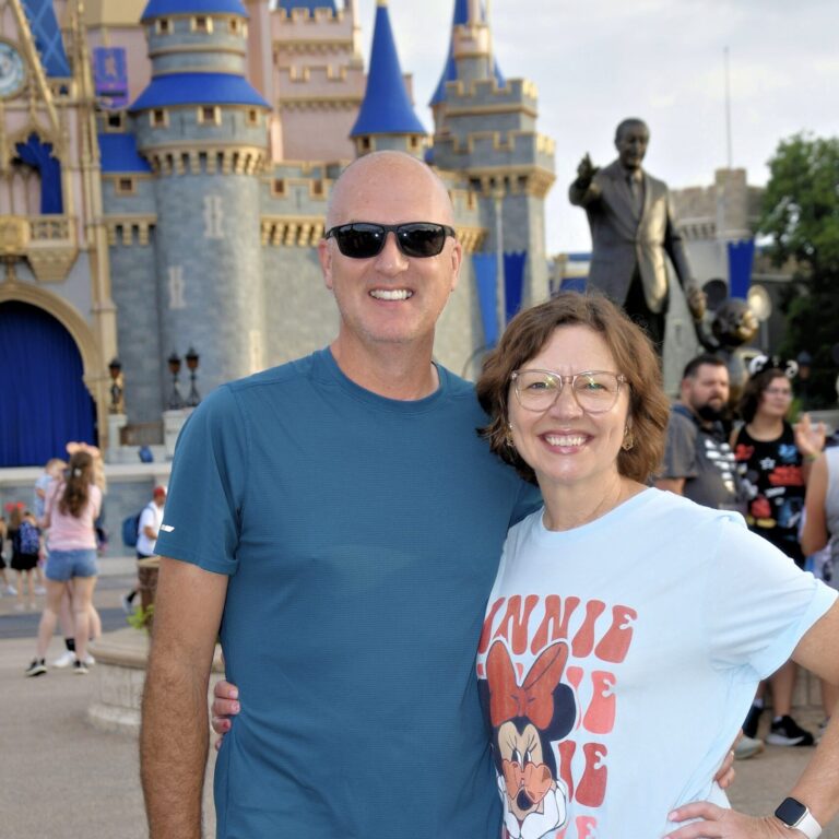 Tammy Hanckock with Husband in front of Walt Disney World's Cinderella Castle